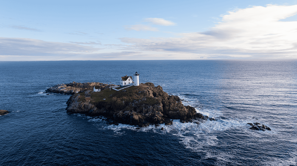 Aerial view of Nubble Lighthouse and rocky island it sits upon.