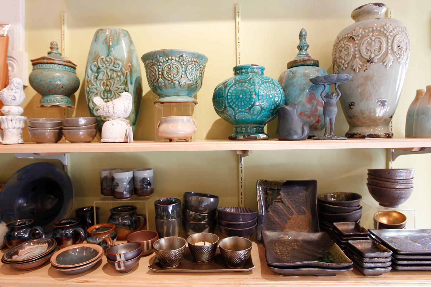 Maine ceramic artist working at pottery wheel creating handcrafted ceramics