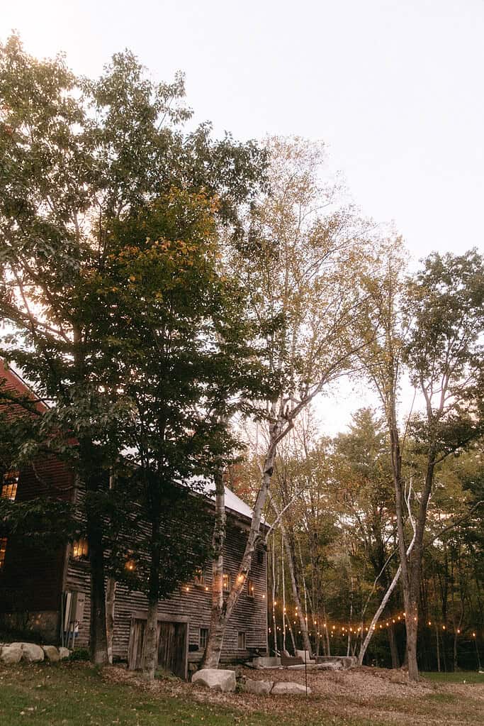 rustic barn with fall leaves and twinkling lights
