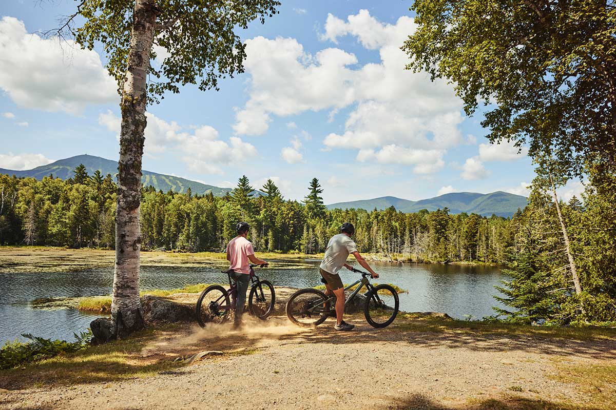 Bikers along a lake