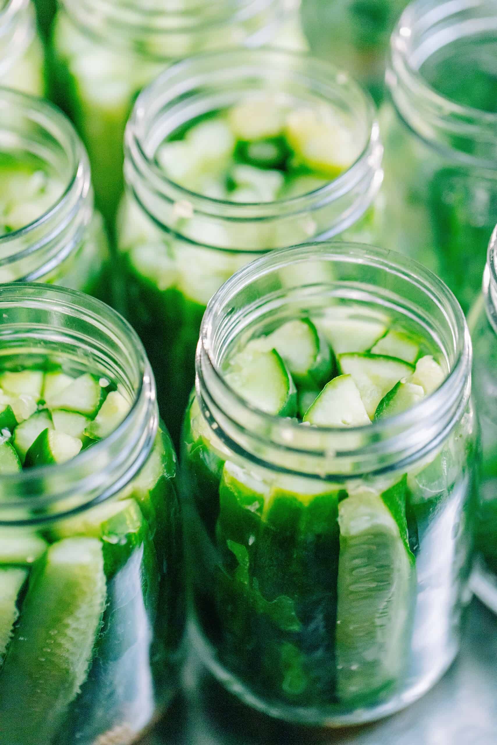 close-up of pickled in jars with the lid off
