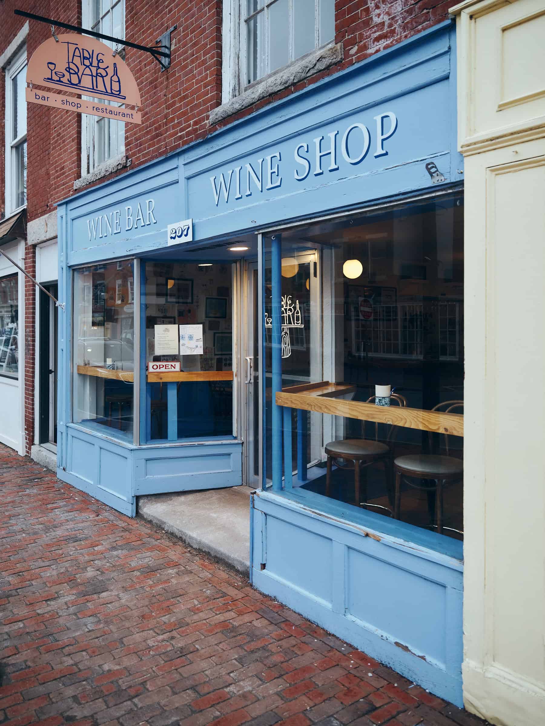 cornflower blue exterior of a wine bar